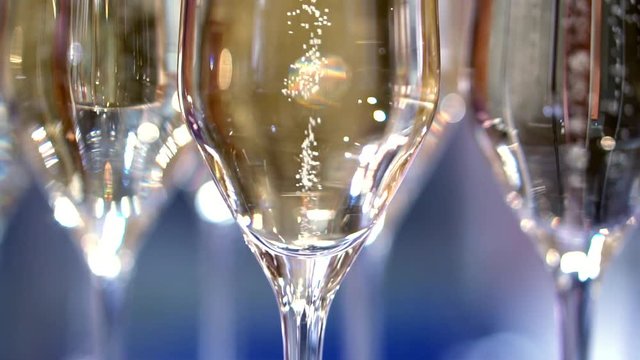 champagne in wine glasses. a sparkling wine. bubbles rise