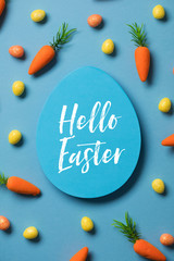 Easter festive background with easter bunny carrots and easter eggs