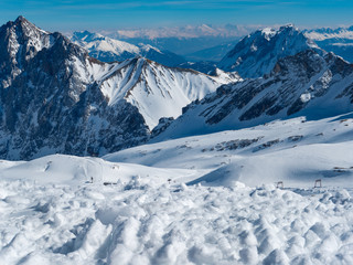Fototapeta na wymiar View from the German Zugspitze across the top of a snow mountain landscape