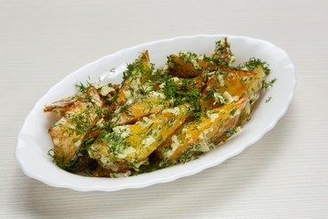 baked rustic potatoes with garlic and chopped dill, vegetarian
