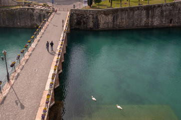 High angle view of the bridge of the fortress of Peschiera del Garda, a massive Venetian defensive system become Unesco World Heritage Site in 2017, Lake Garda, Lombardy, Italy