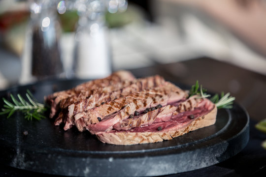Close up of meat slices served on plate