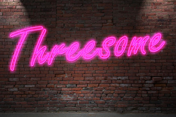 Obraz premium Neon Lettering Threesome on Brick Wall