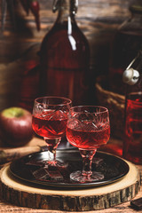 Glass of red liquor with chocolate bars