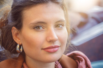 Portrait of smiling brunette woman with hazel eyes