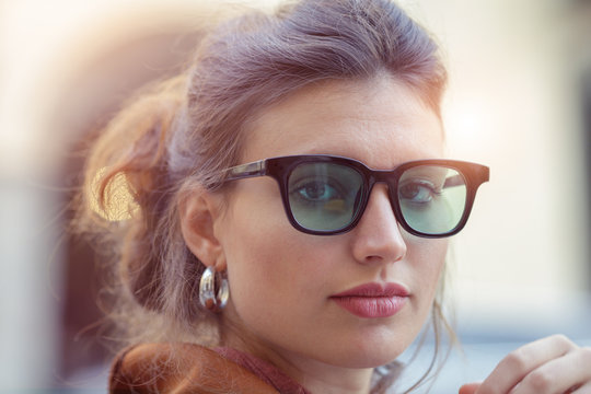 Portrait of brunette woman in eyeglasses