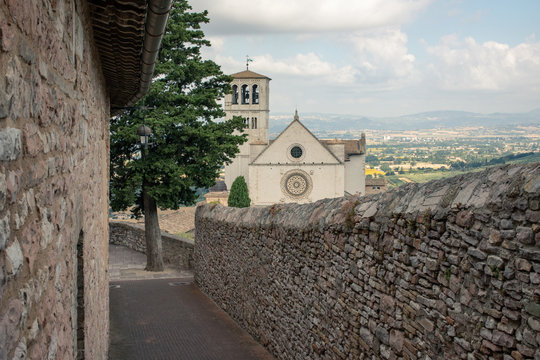 View of empty path in city