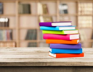 Heap of books with glasses, close-up view