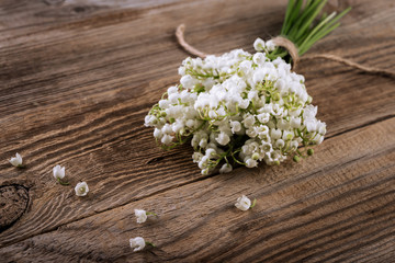 lily of the valley flowers  on wooden background