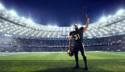 Obraz na płótnie Canvas American football player in professional sport arena.