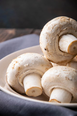 mushrooms closeup on light plate
