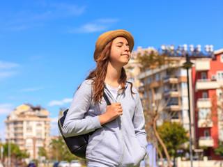 Fototapeta premium Happy cheerful beautiful teen girl on nature in the park. Selective focus