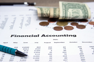 Fototapeta premium Financial accounting, Image a plurality of numbers on paper and calculator, Numbers on paper, a pen and a calculator, coins.