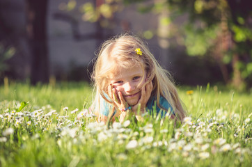 girl lying in meadow