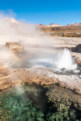 El Tatio Geysers at Atacama desert, amazing thermal spring waters at 4500 masl inside Andes mountains a place with an awe geothermal activity below the ground. Volcanic activity at Atacama scenery
