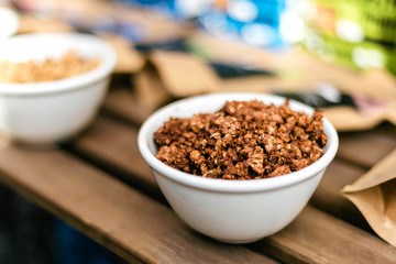 Homemade granola with nuts and seeds in thaplate for healthy breakfast