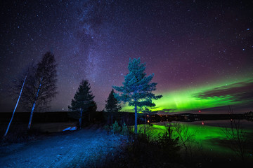 Aurora at clear skies and like reflecting green northern lights like mirror at Scandinavian...
