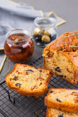 Traditional Italian bread with dried tomatoes and olives. Homemade cakes for lunch and breakfast and ingredients. Free space for text. Copy space
