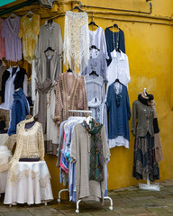 Exhibitors selling lace and embroidery fabrics. Souvenir shop in Burano. Venice. Italy. The famous Burano lace is made by local artisans.