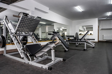 Fototapeta na wymiar Modern and empty gym interior with equipment