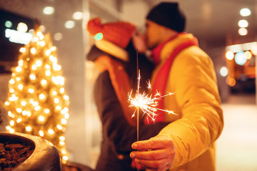 Winter evening, love couple kissing outdoors