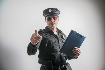 American police officer with a folder of documents