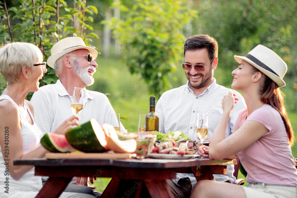 Sticker happy family eating outdoors