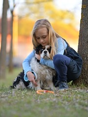 happy child girl with her dog