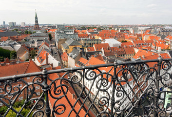 Balcony and cityscape of Copenhagen with churches and historical building, Denmark. Top view on danish capital