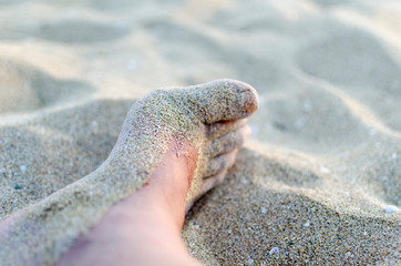 PIE CON ARENA EN LA PLAYA MIAMI USA