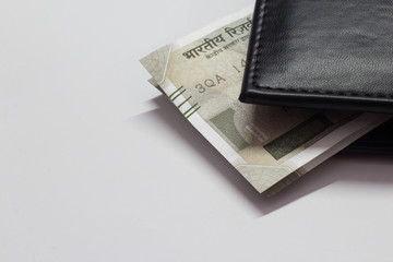 Black wallet with money isolated on white background with space for text