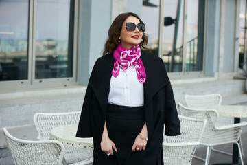 Successful business woman wear trendy white shirt and black skirt.