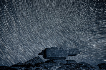 Star trails with alpine rock formation - 259434287