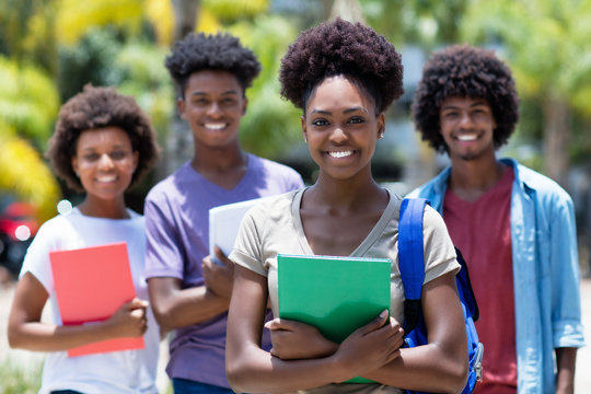 African Female Student With Group Of African American Students