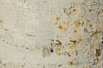 old cracked white paint on rusty iron close up. structure background