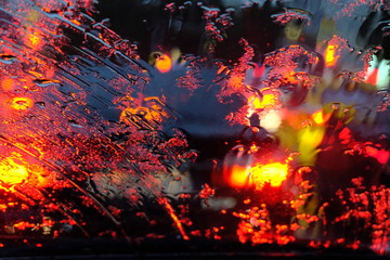 rain outside the car window at night