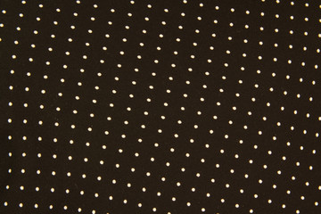 Texture of a black and white small polka dot fabric