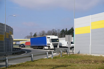 A view of the motorway exit from the passenger rest area. A place surrounded by sound-absorbing screens.