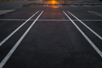 Empty parking lots during Golden Hour sunset at a popular typical Shopping centre