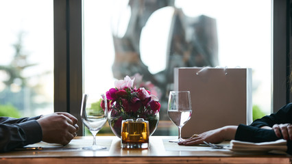 Young couple having romantic dinner in the restaurant, close-up