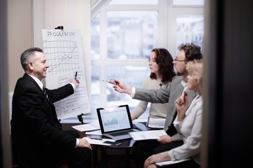 group of senior businessmen discussing a new business project.