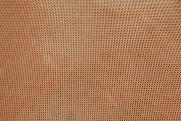 rubber cluster floor. red square covering the ground close up. structure background