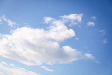 Fluffy white cloud on the blue sky background