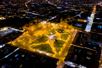 Aerial view of Cusco's main square 'Plaza de Armas' at night. Lively urban gathering place at...