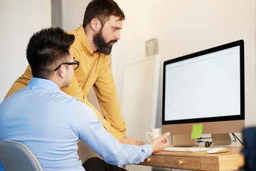 Coworking Process Businessman Desktop Connecting Networking Concept. Two confident young men looking at desktop monitor