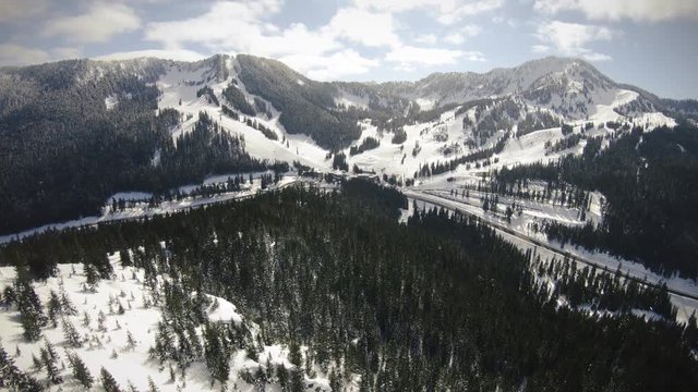 Golden Sunlight on Winter Mountain Resort Aerial in America