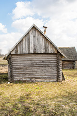 old damaged abandoned wooden building, broken country house of wooden logs, historical slavic architecture abstraction background