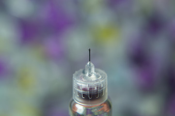 Diabetes insulin syringe with needle closeup. medicine injection