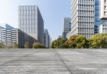 Modern business office buildings with empty road, empty concrete square floor