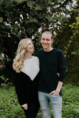 Young Beautiful Couple in Love Being Playful Outside in Nature Laughing and Smiling for Portrait 